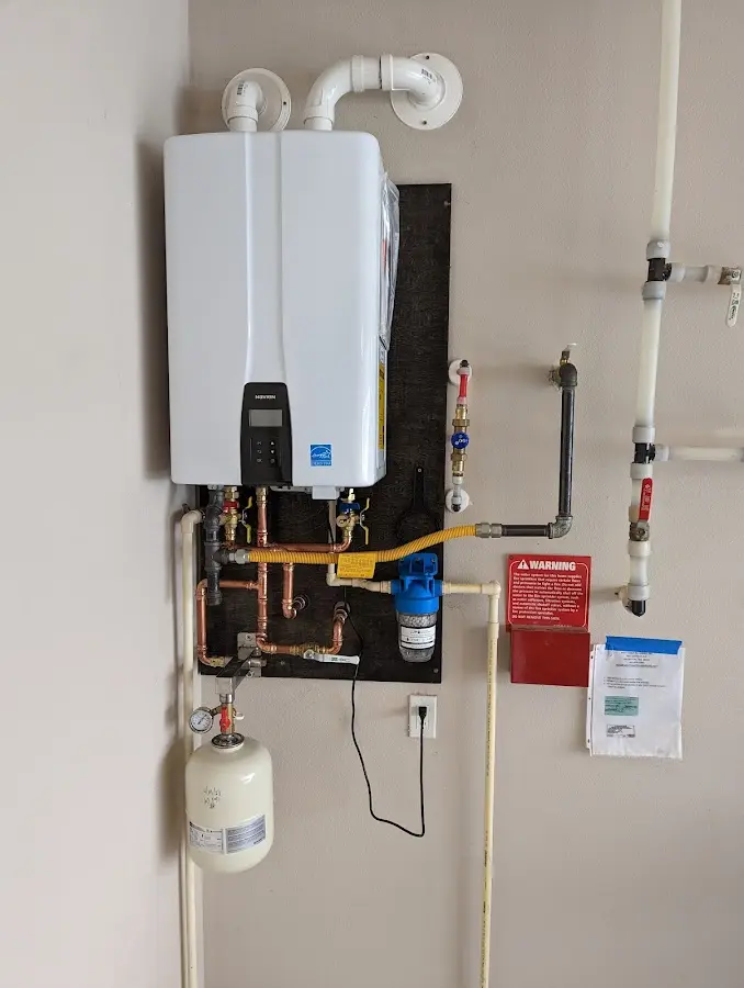 Professional plumber installing copper piping in a Fremont home